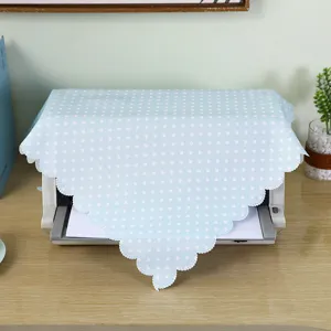 Light blue polka dot fabric dust cover with lace trim for office or home appliance protection.