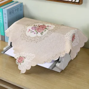 Fabric printer dust cover detail scene, embroidered floral design elegant home office decor.