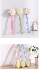 Detailed view of long handled bath brush with soft mesh sponge and massage bristles.