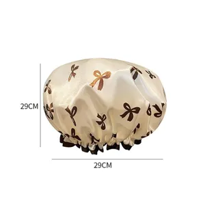 Vista dettagliata della cuffia da doccia impermeabile con fiocco elegante e taglia 29cm.