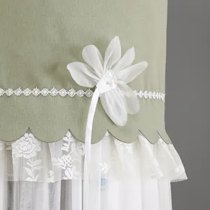 Detail shot of elegant green vertical air conditioner cover featuring white lace flower and trim.