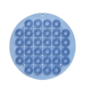 Tappetino da bagno rotondo in silicone blu per massaggio piedi e doccia antiscivolo.