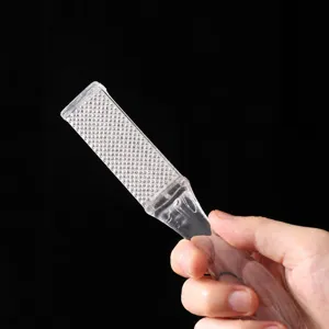 Double-sided foot file and callus remover tool with clear handle for smooth heels and feet.