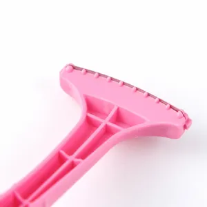 Professional foot callus shaver for dead skin removal, ergonomic pink handle design.