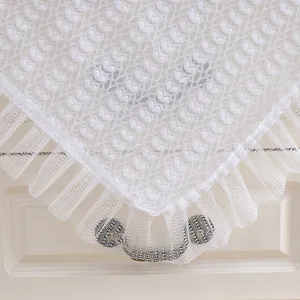 White lace dust cover detail close-up, elegant fabric bedside table runner decoration.