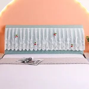 Detailed close-up view of quilted lace headboard cover with cute cherry decor, cozy style.