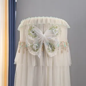 Detailed view of beige vertical air conditioner dust cover with lace butterfly embroidery.