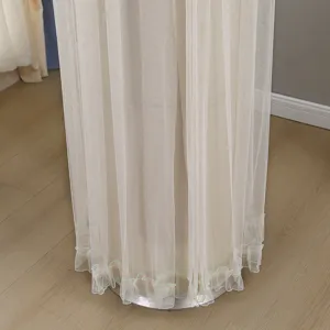 Cylindrical floor standing air conditioner dust cover detail, beige mesh fabric with ruffles.