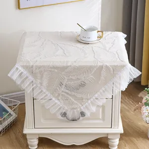 Details of white lace bedside table cover, elegant leaf pattern dust cover for bedroom.