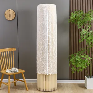 Detail view of a white lace vertical air conditioner dust cover with elegant leaf pattern.