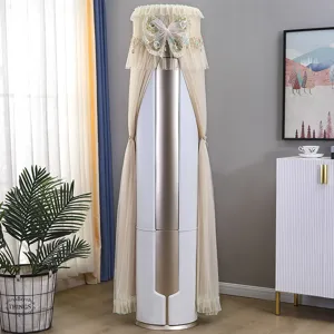 Detail view of a beige lace vertical air conditioner dust cover with embroidered butterfly.