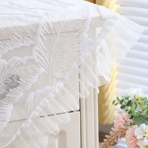 White lace dust cover for nightstand, elegant floral pattern with ruffled edge for home decor.
