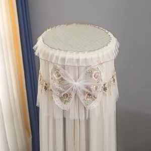 Detailed shot of the elegant lace embroidery butterfly air conditioner dust cover design.