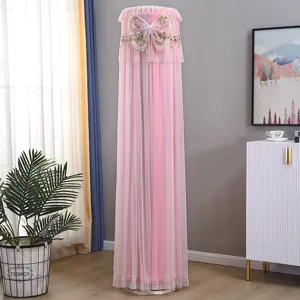 Pink lace cylindrical standing air conditioner dust cover with delicate bow embroidery for home decor.