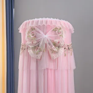 Close-up of pink mesh standing air conditioner dust cover featuring delicate lace embroidery.
