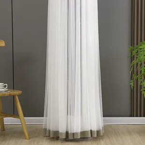 Detailed view of white cylindrical vertical air conditioner cover with brown hem fabric.