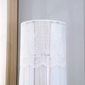 Close up view of the exquisite white lace embroidery pattern on the vertical air conditioner cover detail.