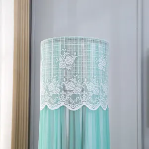 Mint green lace vertical air conditioner dust cover detail view, elegant floral mesh design for home.
