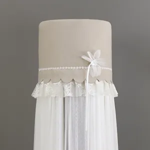 Detailed close-up of a khaki vertical air conditioner cover featuring white lace and flower.