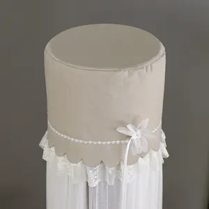Cylinder vertical air conditioner dust cover with elegant lace trim and white floral accent.