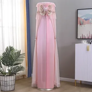 Details showing the elegant pink upright cylinder air conditioner dust cover with lace and bow.