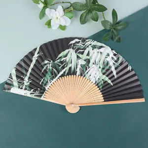 Exquisite folding hand fan featuring wooden bamboo ribs and elegant black paper bamboo art pattern.