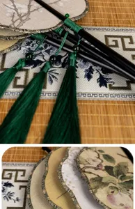 Éventail traditionnel chinois fait main avec glands verts élégants et broderie florale délicate.