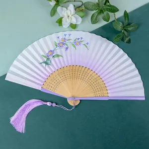Elegant folding hand fan with purple floral pattern and tassel, perfect for summer and gifts.