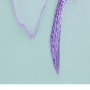 Detailed view of the purple tassel and hanging cord for a traditional Chinese fan.