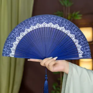 Traditional Chinese silk folding fan with bamboo ribs and elegant tassel for summer daily use.