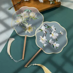 Traditional Chinese style embroidered round fan with wooden handle and delicate tassel.