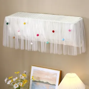 White quilted lace wall mounted air conditioner dust cover with cute colorful pom poms decor.