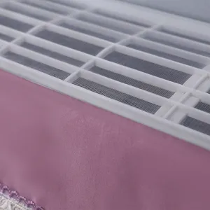 Detailed close-up view of the pink wall-mounted air conditioner dust cover with mesh.