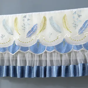 Detailed view of elegant air conditioner dust cover with blue feather embroidery and lace ruffles.