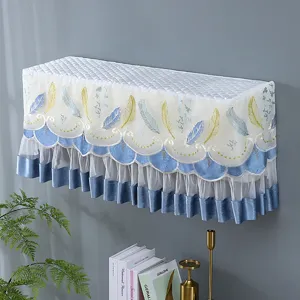 Elegant embroidered feather hanging AC dust cover with lace and blue fringe detail view.