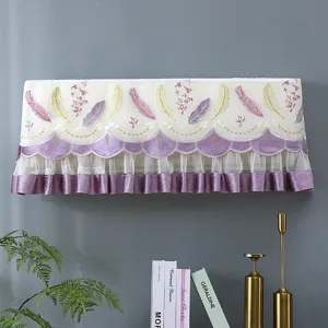 Decorative wall mounted air conditioner dust cover with elegant feather embroidery.