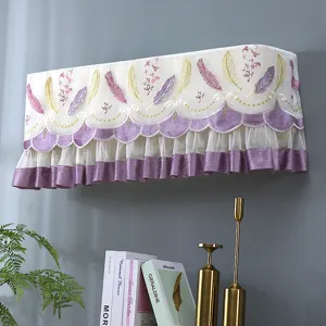 Decorative wall mounted air conditioner dust cover with feather embroidery and purple ruffles.