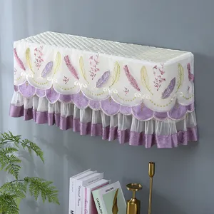 Detailed view of wall-mounted air conditioner dust cover with elegant lace and feather embroidery.