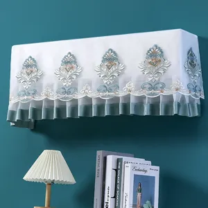 Wall-mounted AC cover with elegant blue gold embroidery and sheer white mesh fabric design.