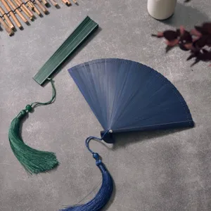 Chinese style folding hand fan with elegant tassel, all bamboo material for summer cooling.
