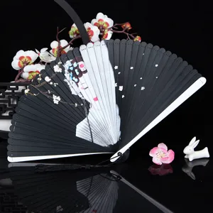 Traditional Chinese folding hand fan with elegant opera lady painting, black bamboo ribs, tassel.