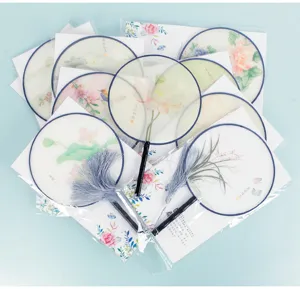 Traditional Chinese style translucent round fan with wooden handle and tassel for Hanfu dance.