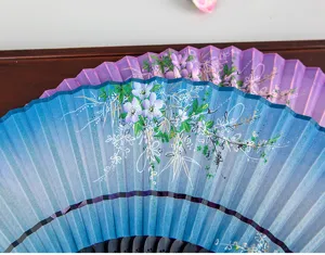 Detailed close-up of a traditional Chinese style folding fan featuring elegant gradient colors and floral art.