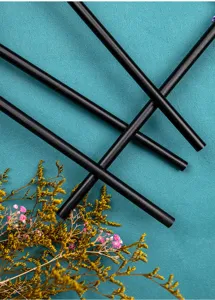 Detailed view of black bamboo fan ribs, showcasing fine texture and craft details.