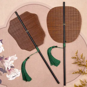Traditional Hanfu bamboo folding fan with long handle and green tassel for vintage photography.
