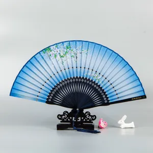 Traditional Chinese folding silk fan with elegant floral design, wooden ribs and display stand.