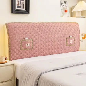 Pink quilted headboard cover with golden lace trim and pocket, soft dustproof protective slipcover.