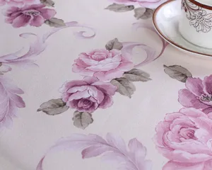 Cotton linen tablecloth detail view featuring elegant pink rose floral pattern for dining table decor.