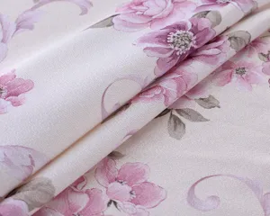 Detailed close-up shot of elegant pink floral pattern fabric for custom tablecloths.