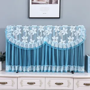 Blue lace TV cover detail, elegant floral pattern and delicate mesh fabric for home decor.